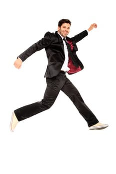 handsome jumping man on suit isolated on a white background