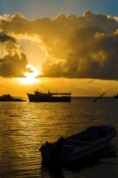 Golden sunrise over boats in Caribbean harbor of San Andres, Colombia