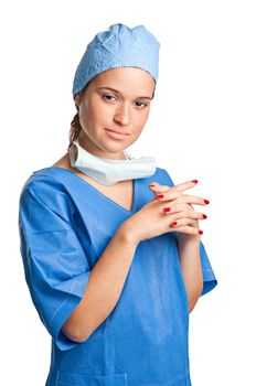 Young female surgeon with scrubs, holding a face mask on a white background