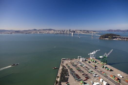 SAN FRANCISCO - OCTOBER 2011: The Oakland Outer Harbor, Bay Bridge and San Francisco on October 26, 2011 in California, USA. The Bay Bridge was opened for traffic on November 12, 1936.