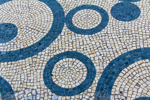 Clear stone blocks pavement texture with a dark central circles loop motive for background