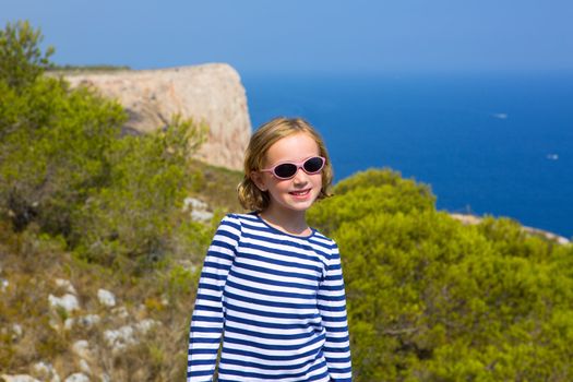 child kid girl in mediterranean sea with summer sailor blue stripes