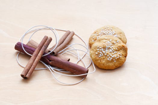 biscuits, cinnamon sticks and a cord
