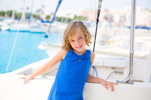 child kid girl in marina boat on summer vacations in Mediterranean