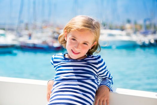 child kid girl in marina boat on summer vacations in Mediterranean