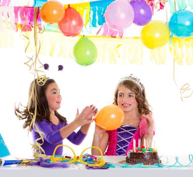 children happy birthday party girls with balloons and chocolate cake