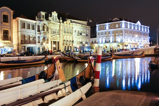Night view the traditional moliceiro boats stopped in  the central canal of Aveiro city, in Portugal