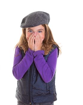 Child kid shy girl smiling hiding her face with hands with winter cap fashion