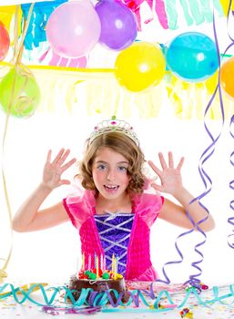 child kid crown princess in birthday party happy gesture and chocolate cake