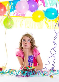 child sad kid crown princess in birthday party bored gesture and chocolate cake