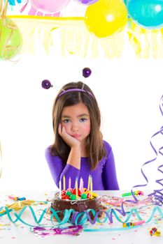 asian child kid girl in birthday party bored sad gesture and chocolate cake
