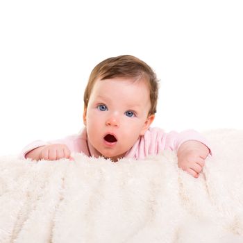 baby girl open mouth funny gesture in pink with winter white fur background