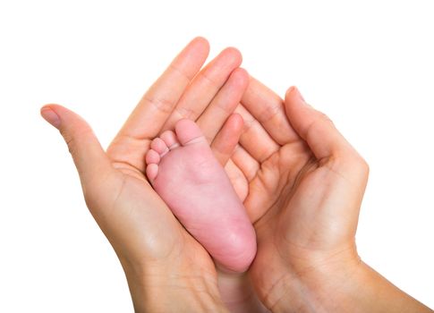 Mother hands holding baby nude foot on white background macro detail