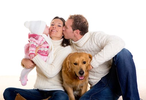 Baby girl mother and father family happy in winter with golden retriever dog