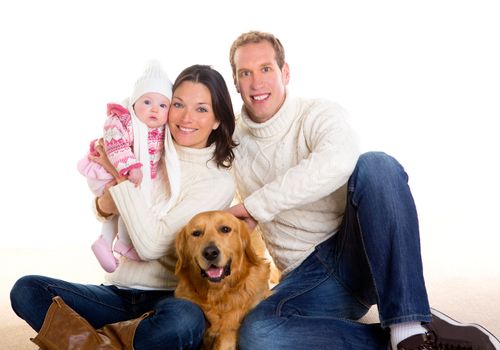 Baby girl mother and father family happy in winter with golden retriever dog