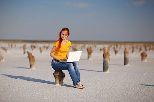 girl with notebook on the salt sand