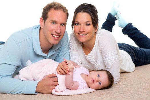 Baby mother and father happy family portrait lying on carpet and white background