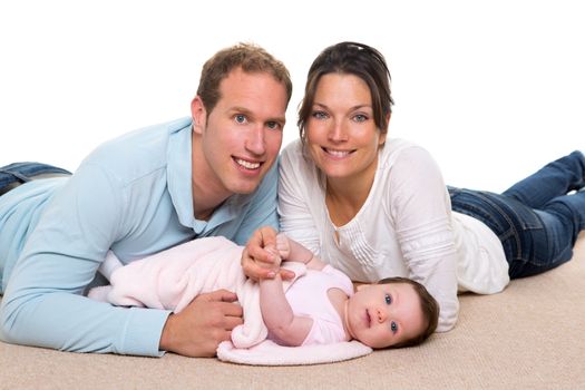 Baby mother and father happy family portrait lying on carpet and white background