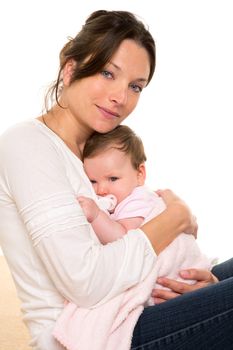 Baby girl relaxed with pacifier hug in mother arms on white background