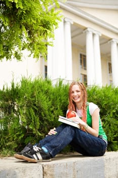 girl with a book near the school