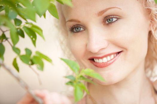 Girl with tree green leaves