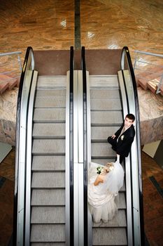 bride and groom in metro
