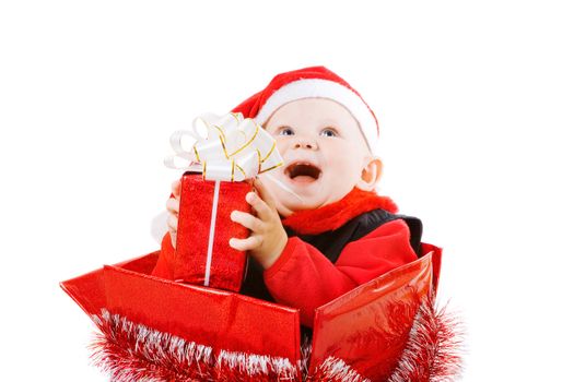 happy infant with gifts in the decorated christmas box