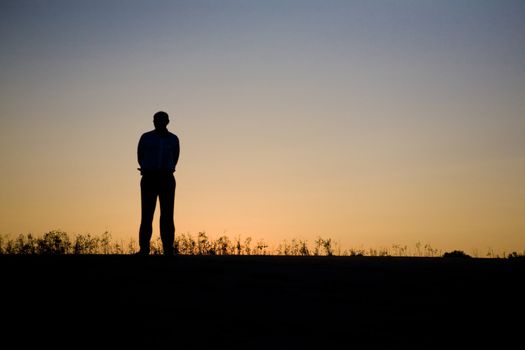 Silhouette of the man in the sunset