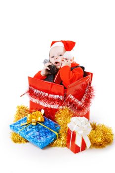 infant with gifts in the decorated christmas box