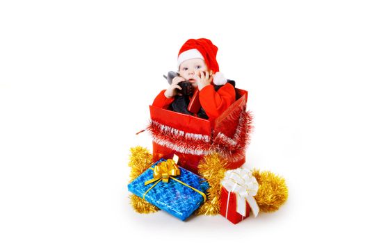 infant calling by phone in the decorated christmas box