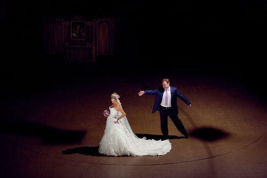 bride and groom on the theater stage