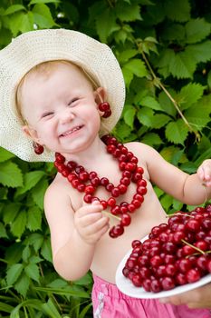 small girl with red cherry beads and earings