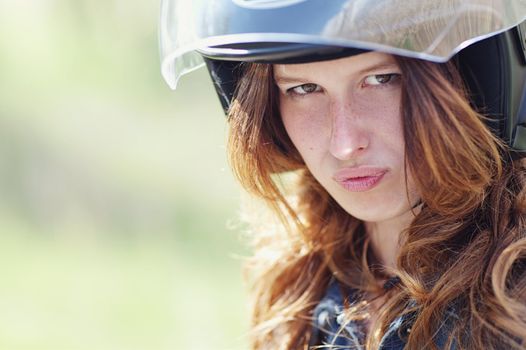 portrait of a young girl in motorcycle helmet
