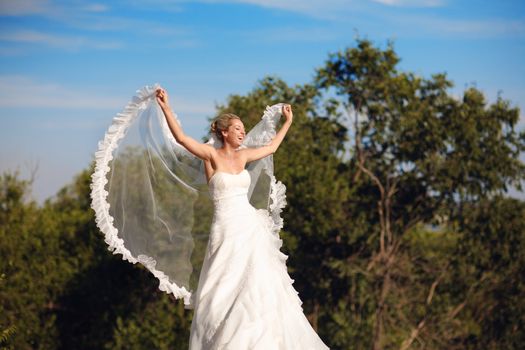 bride with flying veil as wings