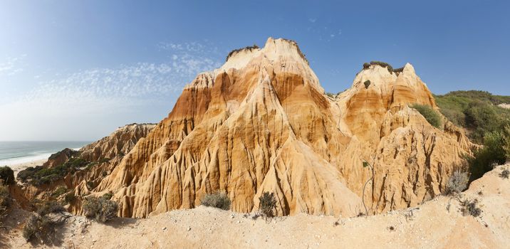 Stitched panorama of the sandstone cliffs in Gale beach, Comporta , Portugal