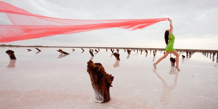 girl with red shawl runs 