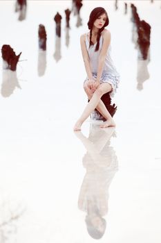 sitting girl in a salt lake