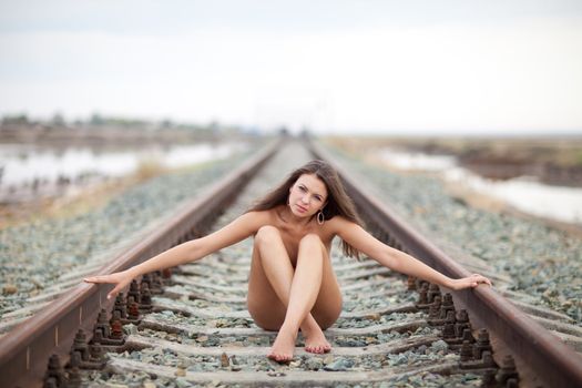 siting girl on the railway