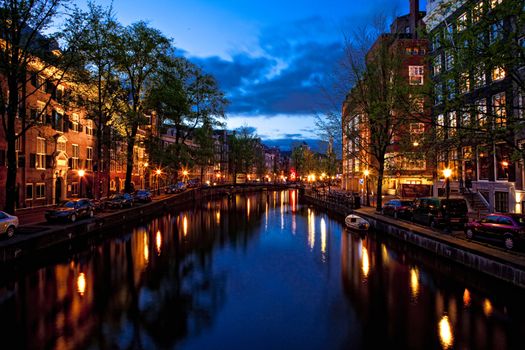 Beautiful night view of the channel in Amsterdam