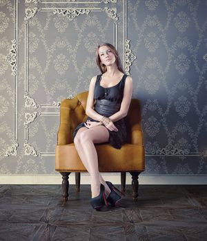 beautiful woman in luxury armchair 