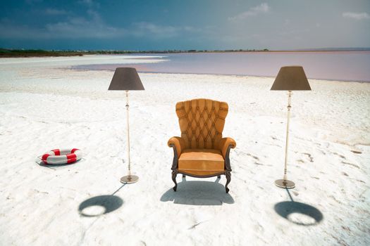 luxury leather armchair on the beach (photo compilation concept)