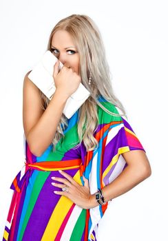 Girl hiding over a purse on a white background