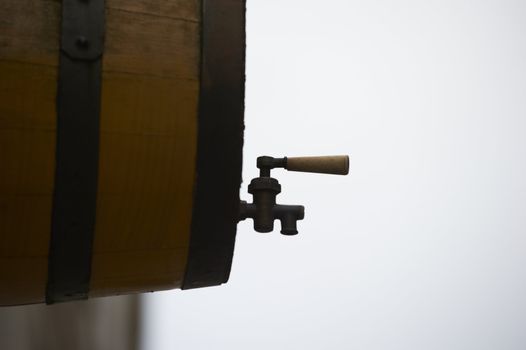 Wooden wine barrel and tap