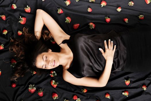 A young adult american woman dreaming of strawberries.