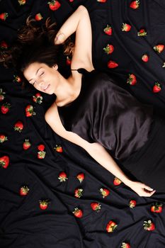 A young adult american woman dreaming of strawberries.