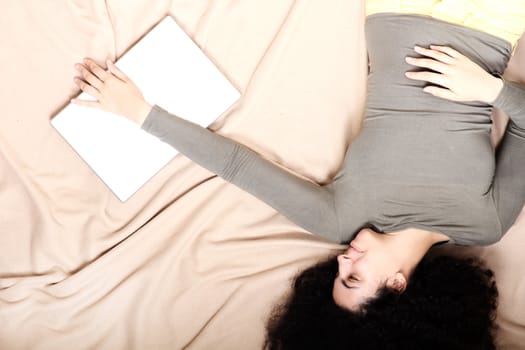 A young adult woman with a Laptop.