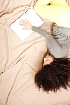 A young adult woman with a Laptop.