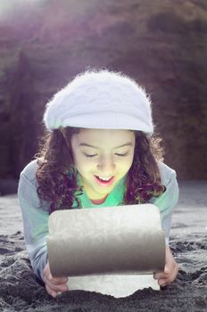 Lovely child opening a magic box