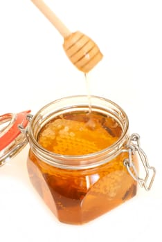 healthy organic honey in a jar isolated on white background