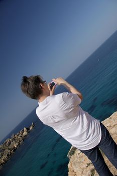 A senior woman taking pictures during her holiday